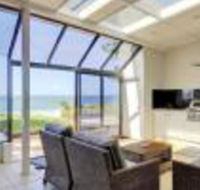Whispering Sands 10 Sandy Point Road Luxury waterfront home with aircon WIFI  Foxtel - Yamba Accommodation