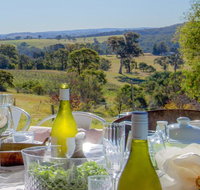 The Farmhouse - grape vines and rolling green hills - Yamba Accommodation
