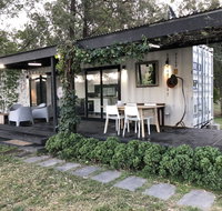 Absolute riverfront shipping container cabin - Yamba Accommodation